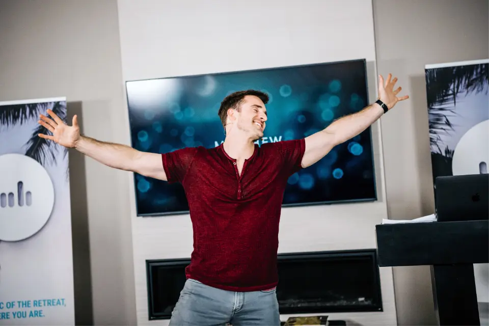 Matthew Hussey spreading his arms wide