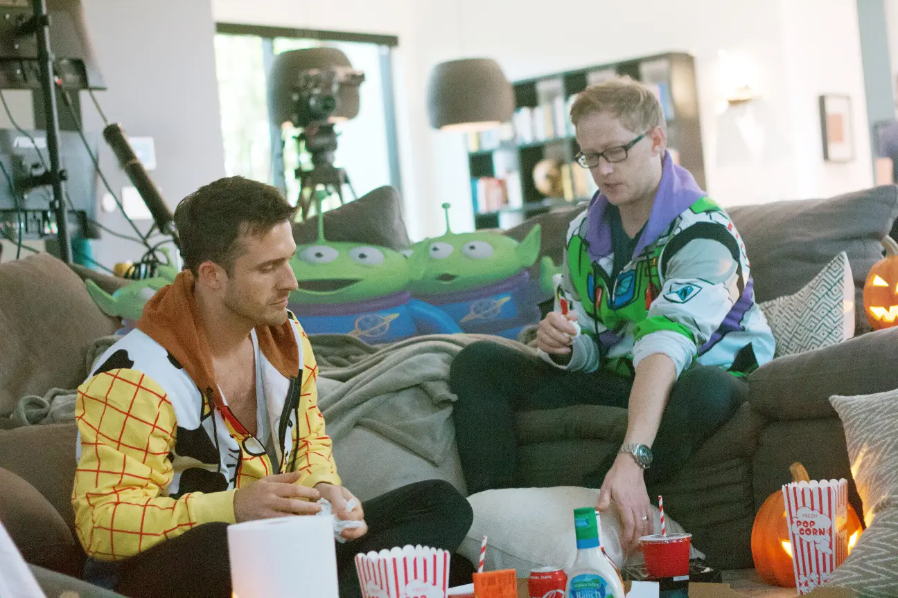 Matthew Hussey dressed as Woody sitting next to his friend dressed as Buzz Lightyear