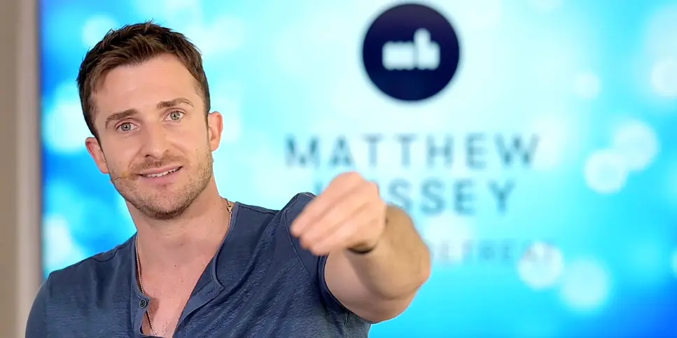 An image of Matthew Hussey pointing at the camera