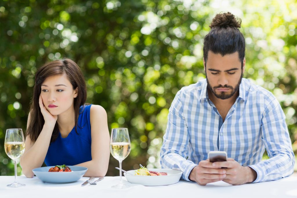 couple bored at lunch